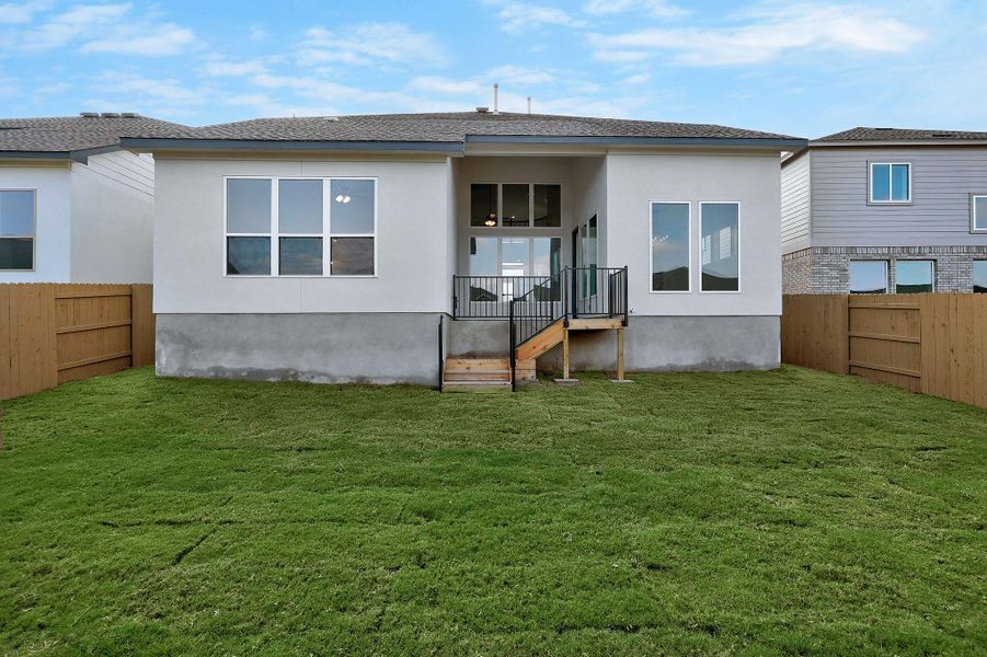 Exterior details and patio area of a home in The Colony, Bastrop (Image 4).