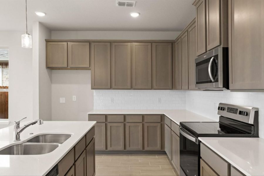 Representative furnished interior of a home built from the Basswood II Colony At Pinehurst Signature by Brohn Homes in Colony at Pinehurst, Pinehurst (Image 7).