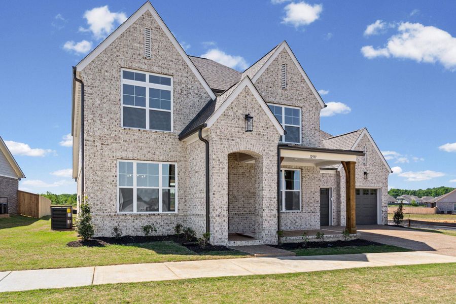 Front exterior of a new home in White Oak, Arlington, TN, highlighting curb appeal (Image 2).