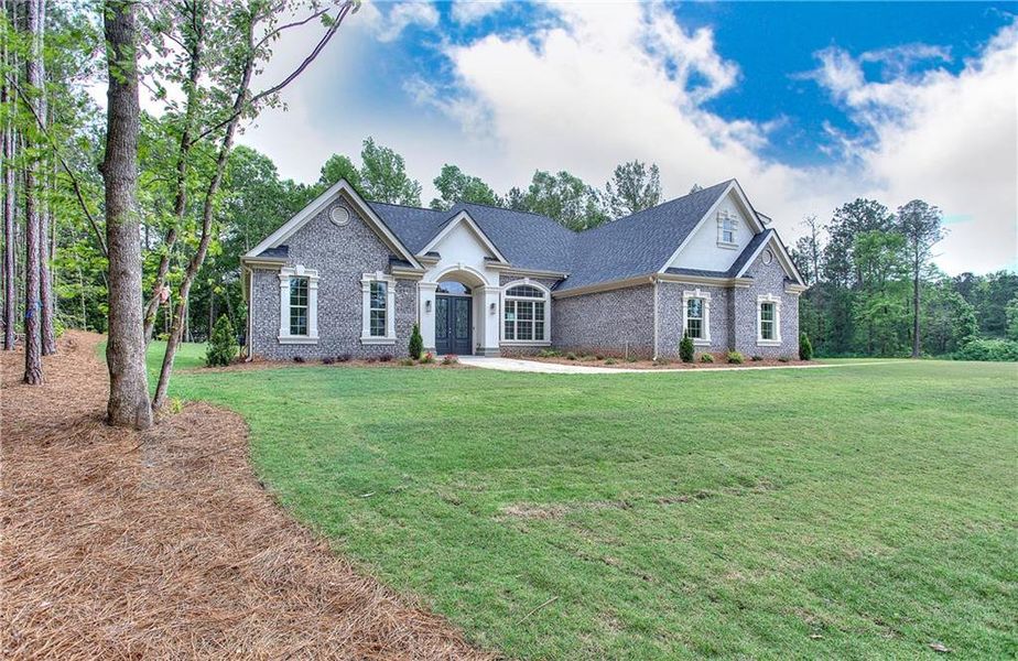 Front exterior of a new home in , Conyers, GA, highlighting curb appeal (Image 32). Front exterior of a new home in , Conyers, GA, highlighting curb appeal (Image 32).
