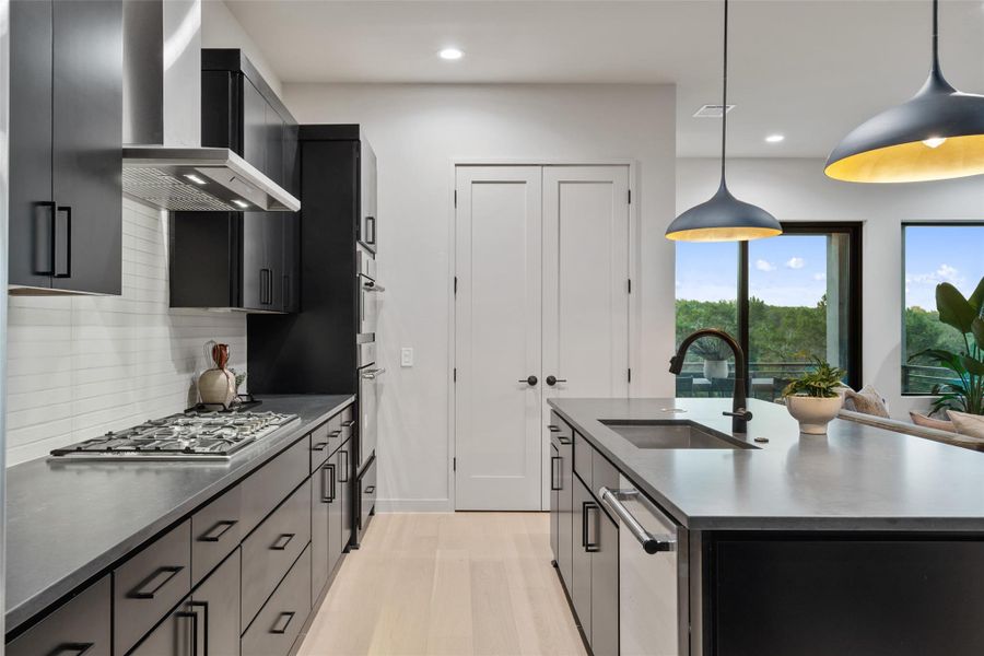 A contemporary kitchen featuring abundant cabinet storage and sleek countertops. A contemporary kitchen featuring abundant cabinet storage and sleek countertops.