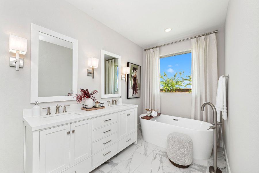 Primary bath with freestanding tub and glass shower enclosure Primary bath with freestanding tub and glass shower enclosure