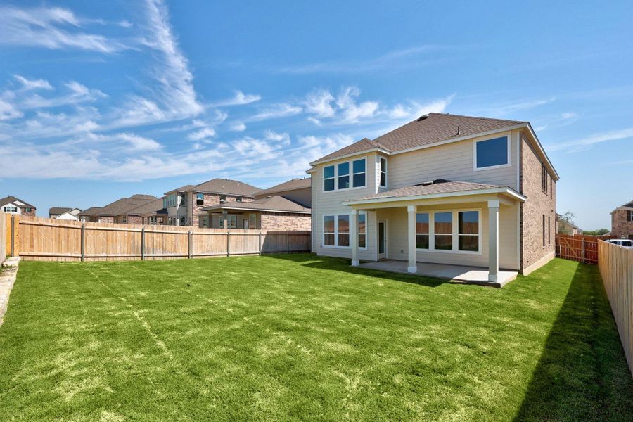 Front exterior of a new home in Salerno - Classic Collection, Round Rock, TX, highlighting curb appeal (Image 24). Front exterior of a new home in Salerno - Classic Collection, Round Rock, TX, highlighting curb appeal (Image 24).