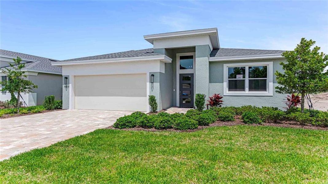 Front exterior of a new home in The Reserve at Victoria, Deland, FL, highlighting curb appeal (Image 1). Front exterior of a new home in The Reserve at Victoria, Deland, FL, highlighting curb appeal (Image 1).