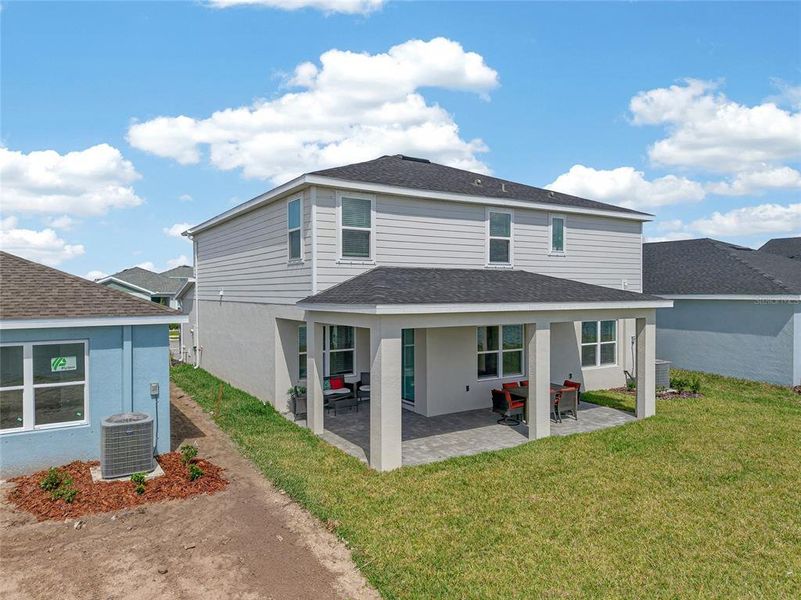 Exterior details and patio area of a home in West Port Single Family Homes, Port Charlotte (Image 3).