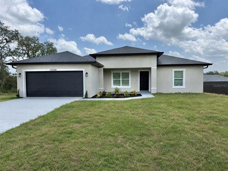 Front exterior of a new home in , Ocala, FL, highlighting curb appeal (Image 23). Front exterior of a new home in , Ocala, FL, highlighting curb appeal (Image 23).