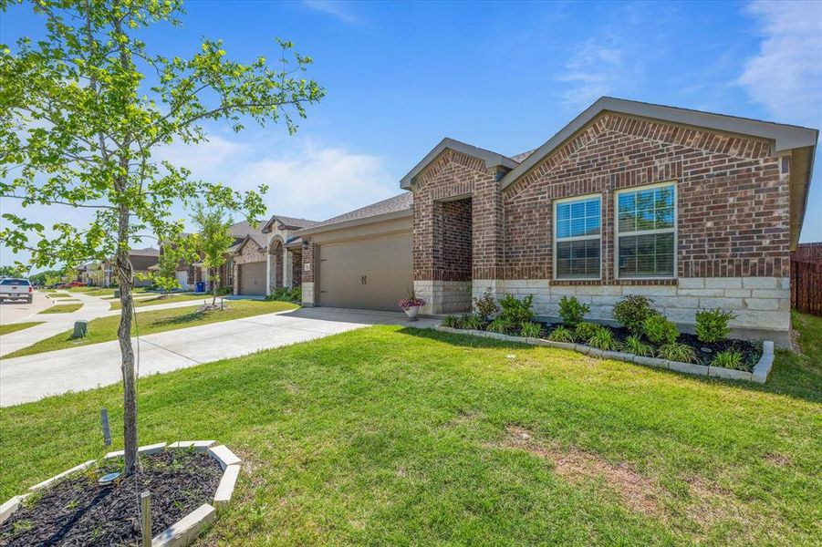 Front exterior of a new home in Millstone, McKinney, TX, highlighting curb appeal (Image 22). Front exterior of a new home in Millstone, McKinney, TX, highlighting curb appeal (Image 22).