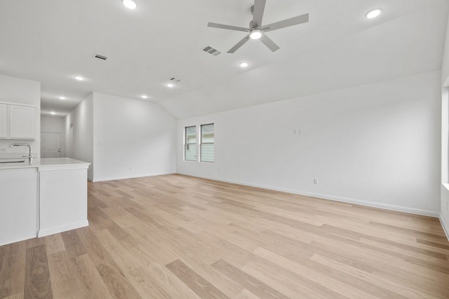 Living and Dining Area in the Quartz home plan by Trophy Signature Homes – REPRESENTATIVE PHOTO