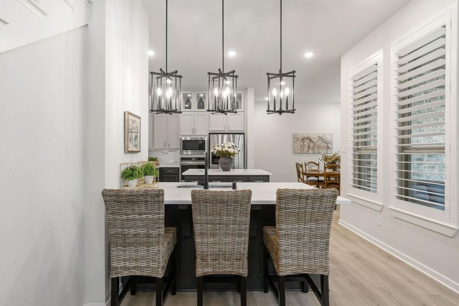Perfect floor plan includes a breakfast area with room for at least three barstools - shutters are on all windows except for two bedrooms up.