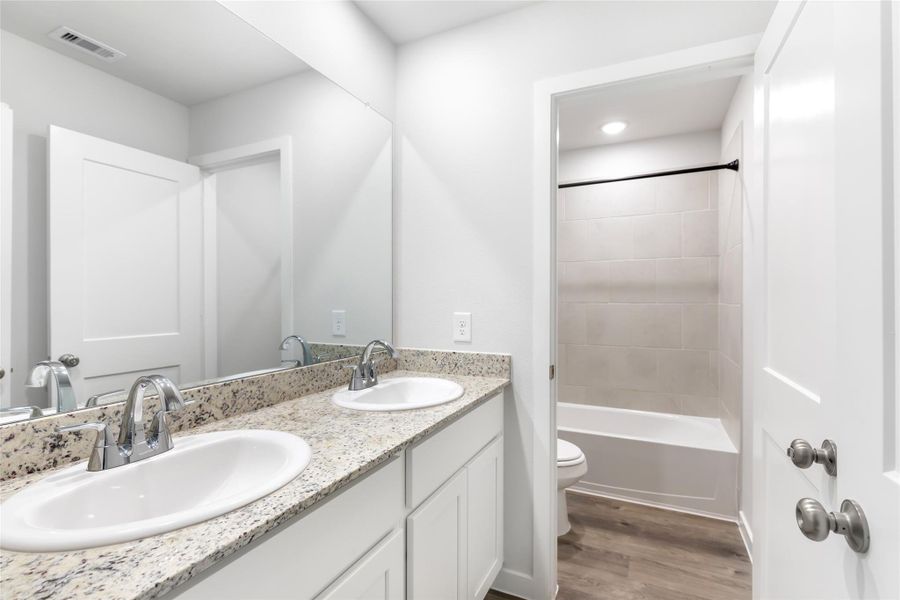 Furnished interior view inside a new home in Barrett Crossing, Crosby (Image 13).
