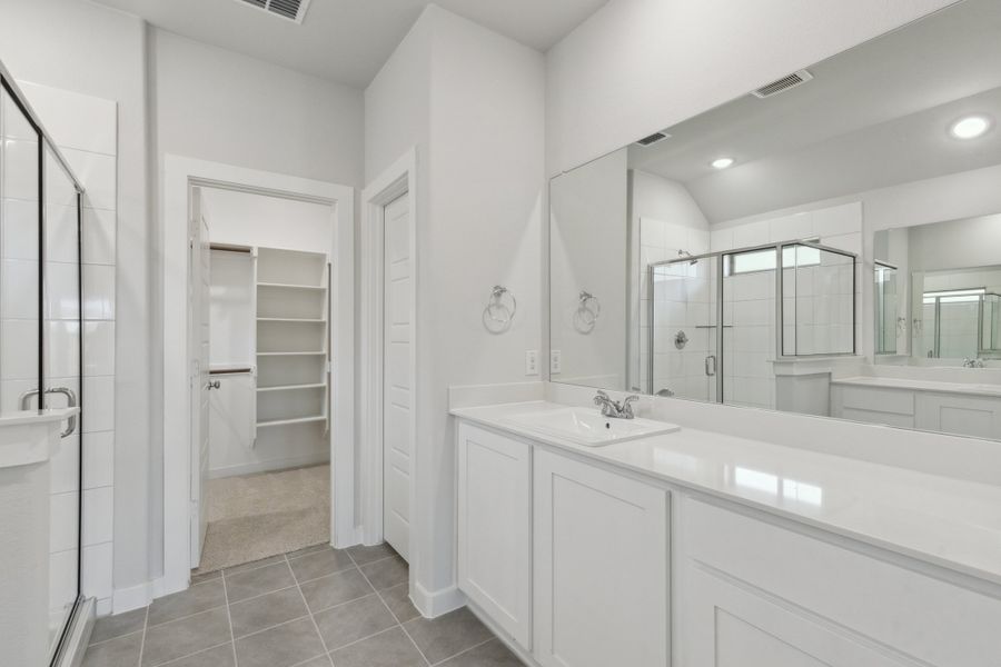 Primary Bathroom in the Harrison home plan by Trophy Signature Homes – REPRESENTATIVE PHOTO