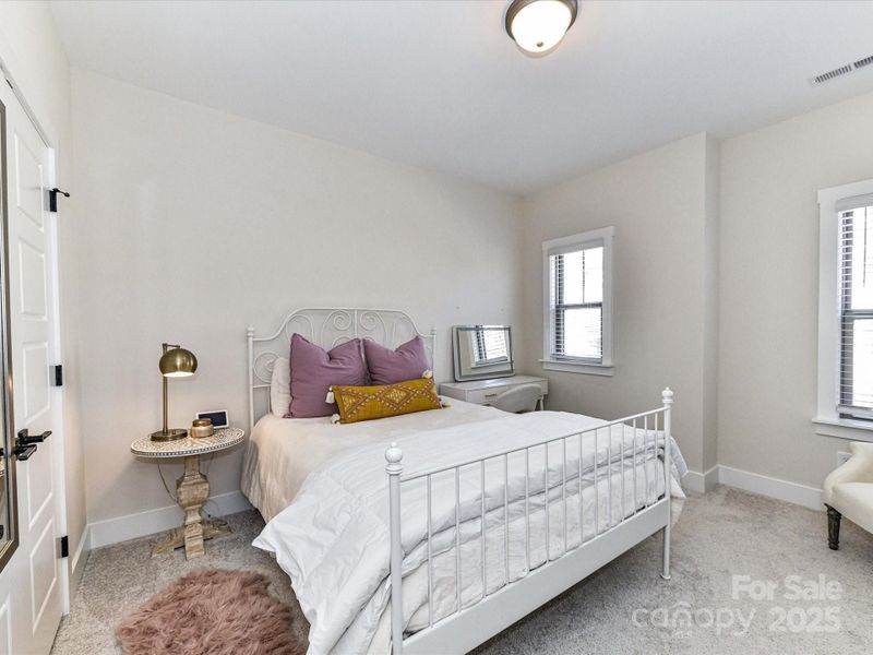 Spacious Secondary Bedroom on upper level with great natural light!