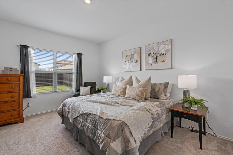 Carpeted bedroom featuring baseboards and recessed lighting