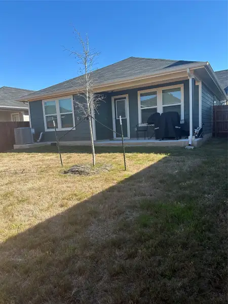 Rear view of property with a patio