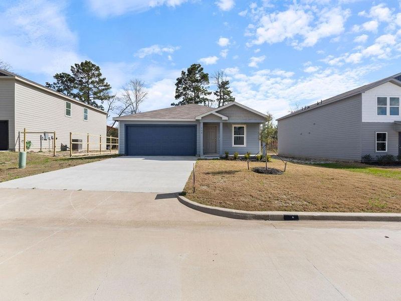 Front exterior of a new home in , Lufkin, TX, highlighting curb appeal (Image 16).