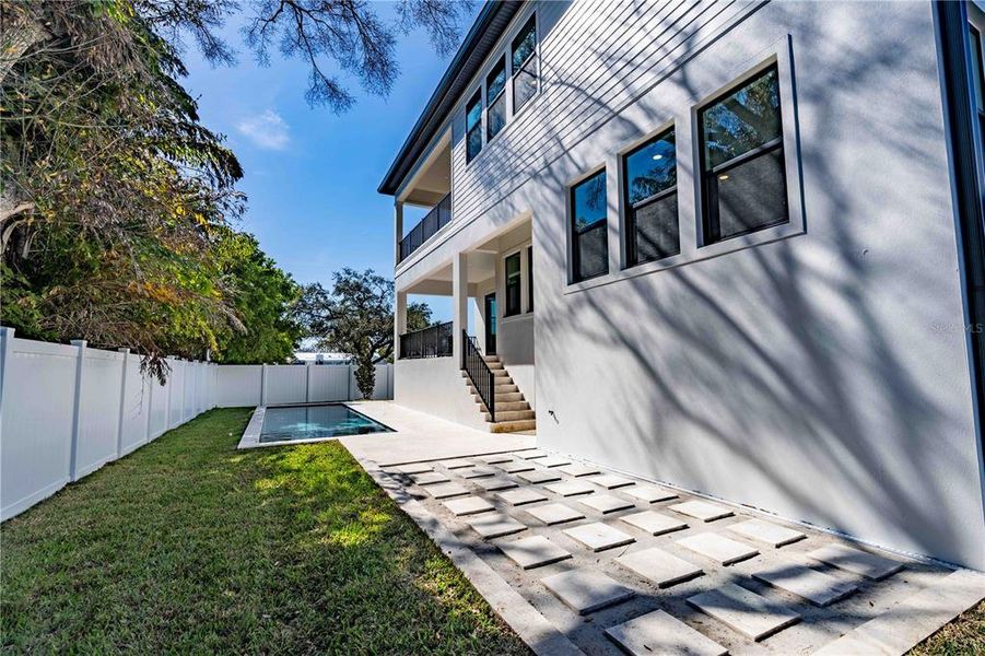 Exterior details and patio area of a home in City Homes - South Tampa, Tampa (Image 16).