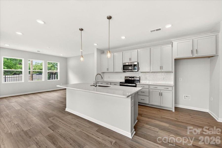 Chef-inspired kitchen with large island Chef-inspired kitchen with large island