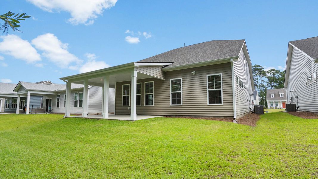 Covered rear porch and back yard