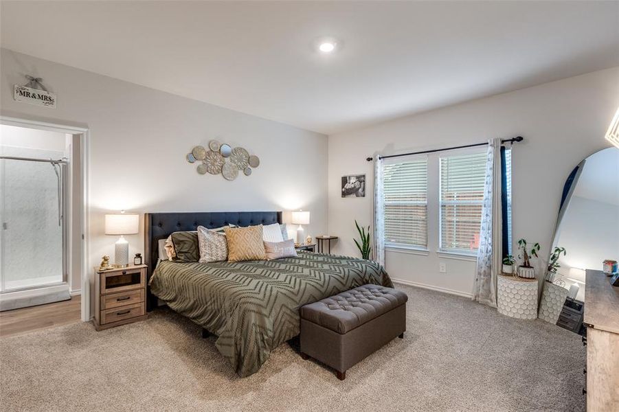 Carpeted bedroom featuring baseboards Carpeted bedroom featuring baseboards
