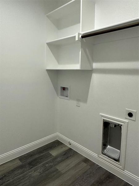 Washroom with dark wood-style flooring, washer hookup, baseboards, electric dryer hookup, and gas dryer hookup