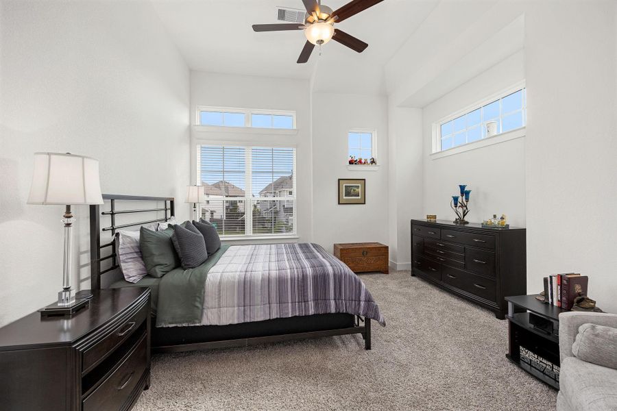 Primary Bedroom located on the second floor, four windows fill the room with natural light