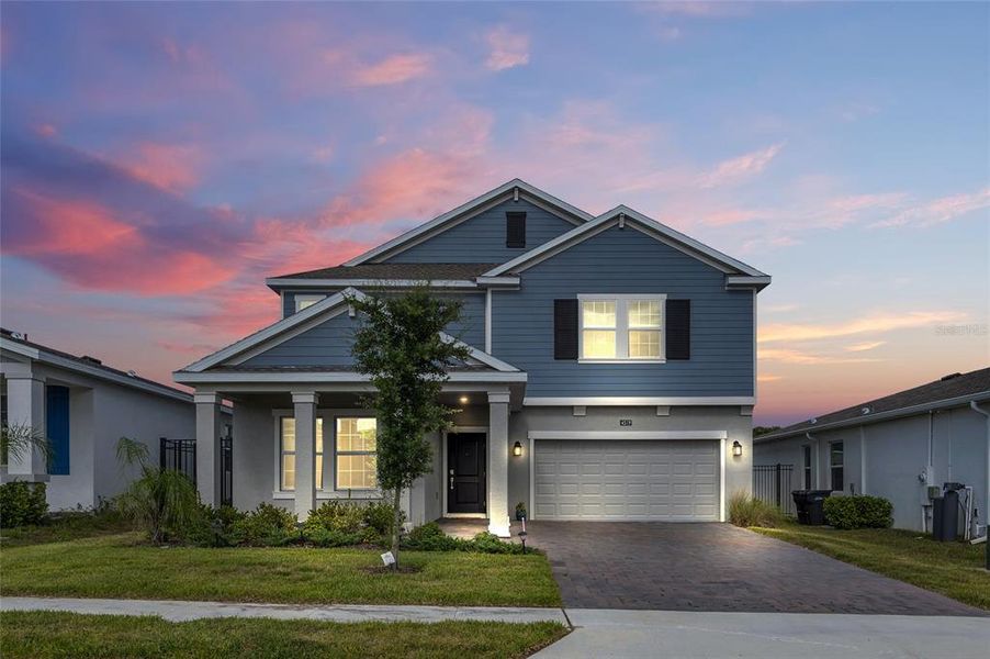 Front exterior of a new home in Providence, Davenport, FL, highlighting curb appeal (Image 23).