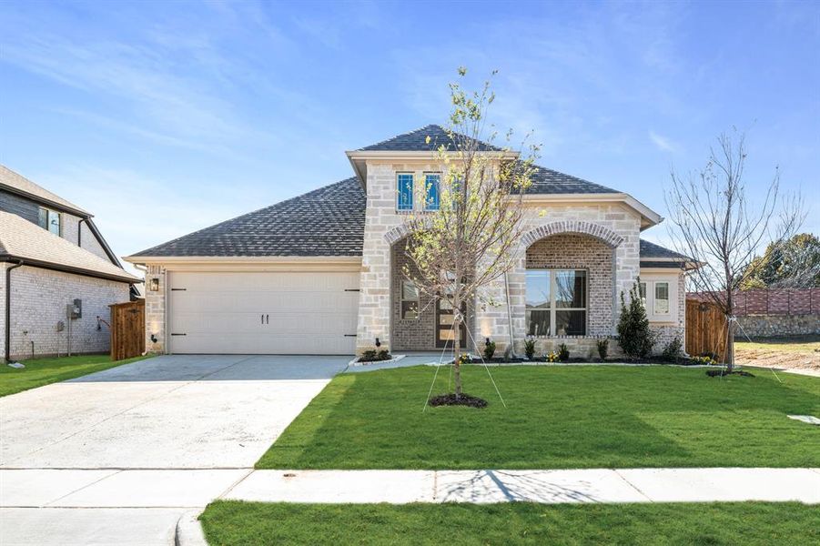Front exterior of a new home in Mockingbird Hills 60-65, Joshua, TX, highlighting curb appeal (Image 2).