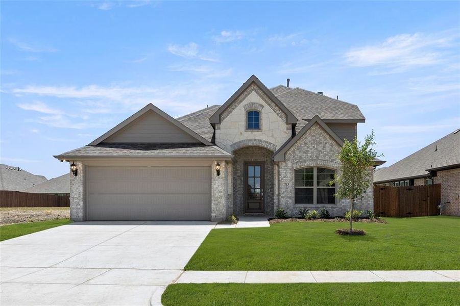 Front exterior of a new home in The Parks at Panchasarp Farms - Phase 2, Burleson, TX, highlighting curb appeal (Image 1). Front exterior of a new home in The Parks at Panchasarp Farms - Phase 2, Burleson, TX, highlighting curb appeal (Image 1).
