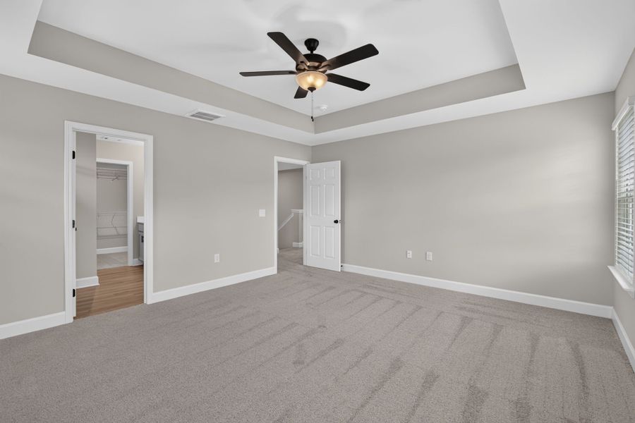 Primary Bedroom View Toward En Suite Bath & Walk-In Closet at 245 James Drive – Dunham Marsh