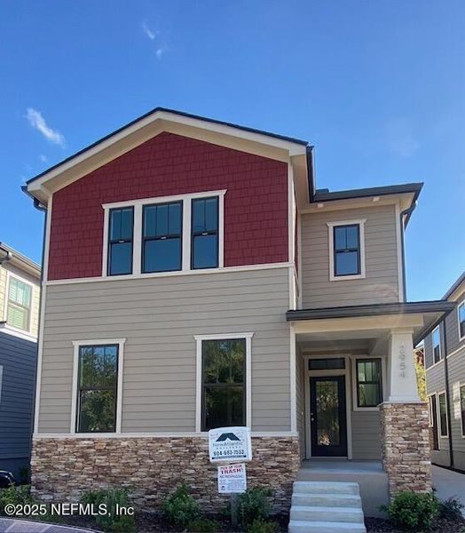 Front exterior of a new home in , Jacksonville, FL, highlighting curb appeal (Image 1).