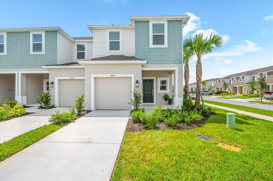 Front exterior of a new home in , Sarasota, FL, highlighting curb appeal (Image 22).