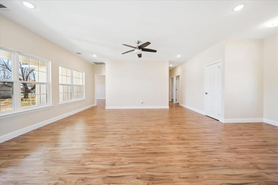 Empty room featuring light hardwood / wood-style floors and ceiling fan