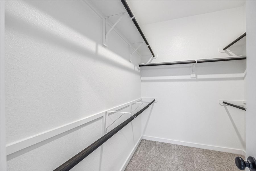 Generous walk-in closet with ample storage