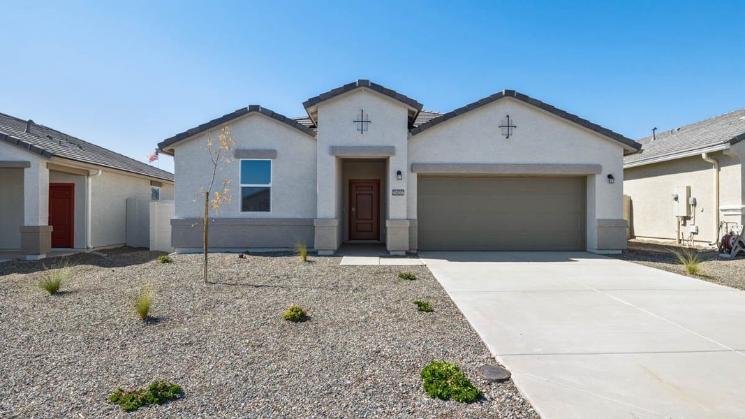 Front exterior of a new home in Entrada Del Oro, Gold Canyon, AZ, highlighting curb appeal (Image 1). Front exterior of a new home in Entrada Del Oro, Gold Canyon, AZ, highlighting curb appeal (Image 1).