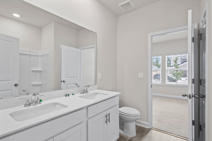 Furnished interior view inside a new home in Cypress Ridge - The Coastline Series, Longs (Image 11).