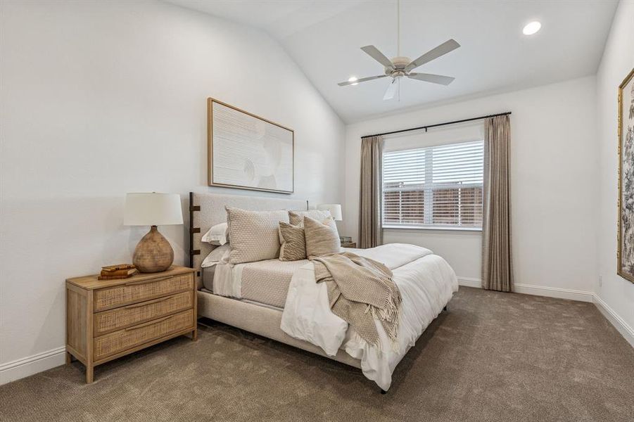 Carpeted bedroom with lofted ceiling, a ceiling fan, and recessed lighting