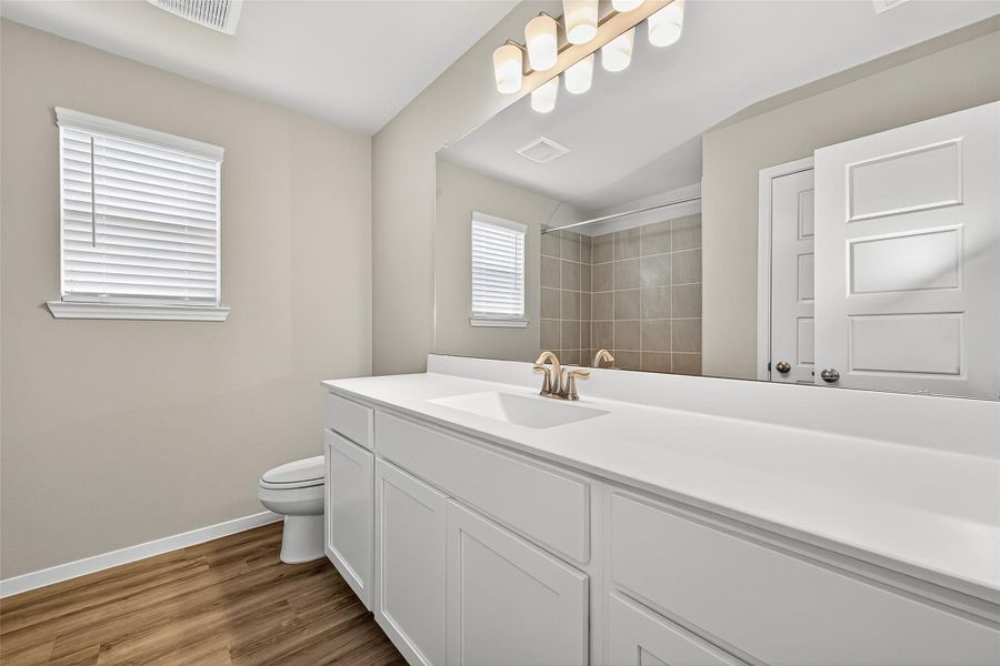 Furnished interior view inside a new home in Sunterra, Katy (Image 6).