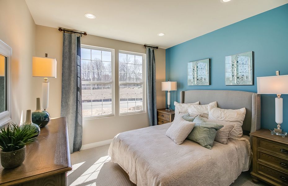 Bedroom 2 with blue accent wall and room for a dre Bedroom 2 with blue accent wall and room for a dre