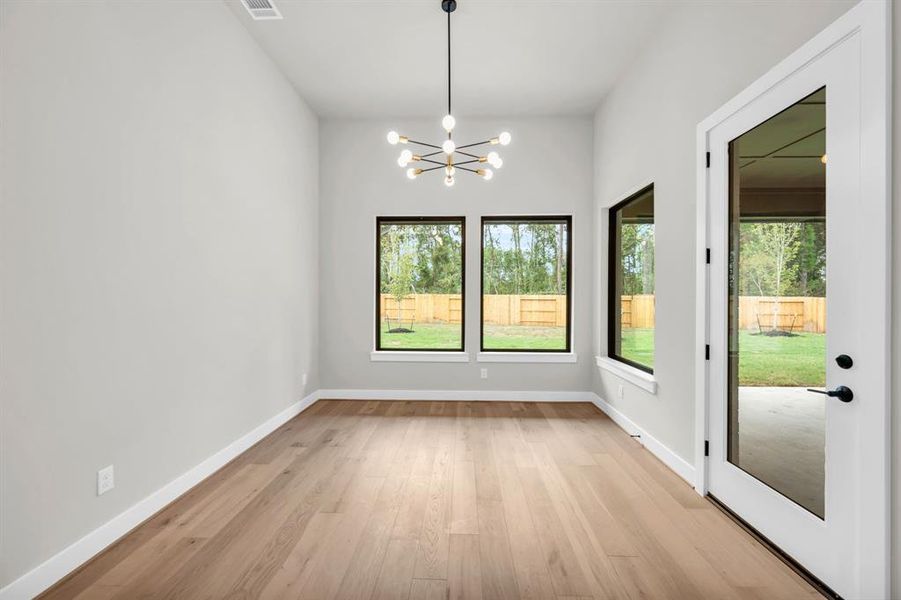 Dining room with backyard views