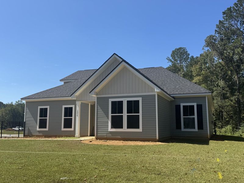 Front exterior of a new home in Central Estates, Summerville, SC, highlighting curb appeal (Image 1).