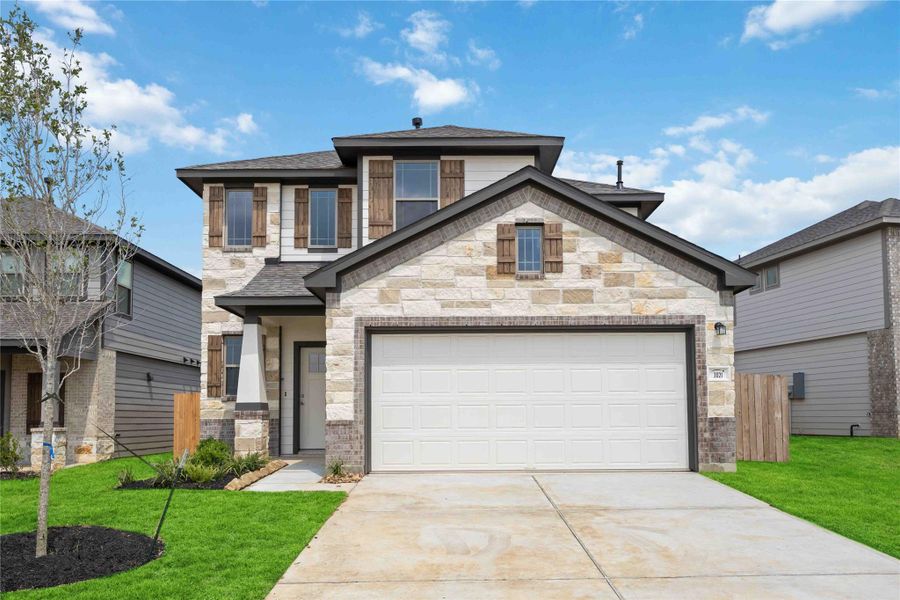 Front exterior of a new home in Bluestem, Brookshire, TX, highlighting curb appeal (Image 1). Front exterior of a new home in Bluestem, Brookshire, TX, highlighting curb appeal (Image 1).