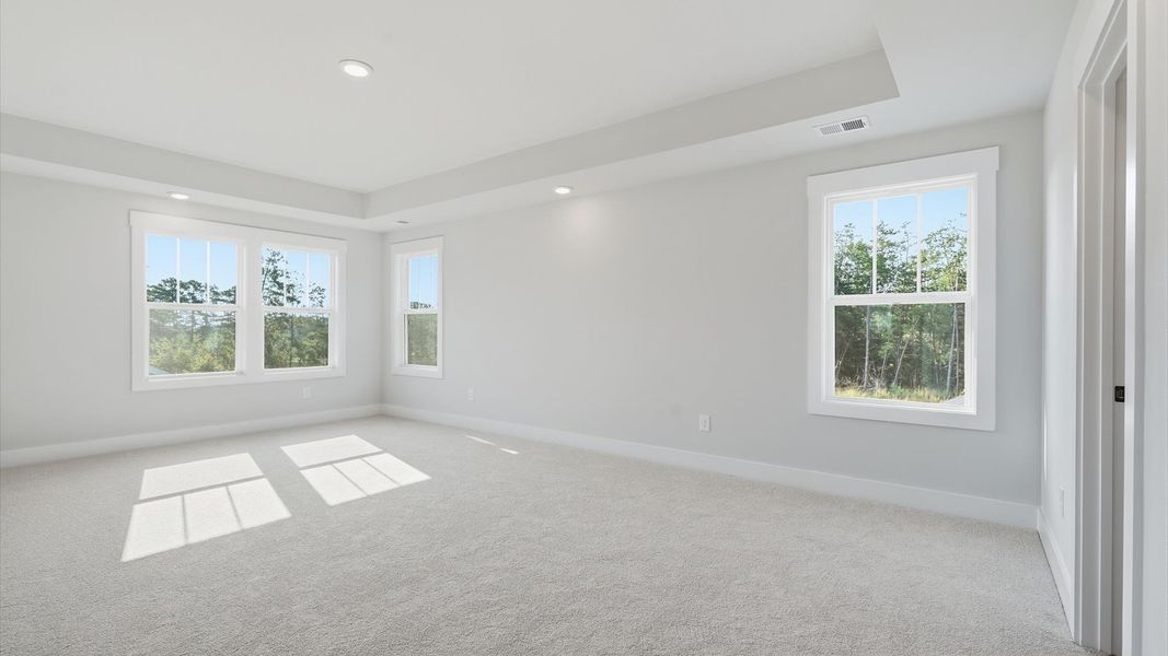 Primary suite that offers first-rate relaxation with established style and elevated finishes