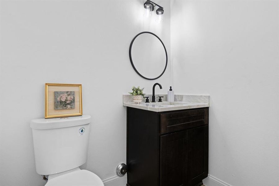 Bathroom featuring toilet and vanity