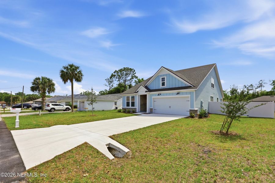 Front exterior of a new home in Palm Coast Homes, Palm Coast, FL, highlighting curb appeal (Image 28).