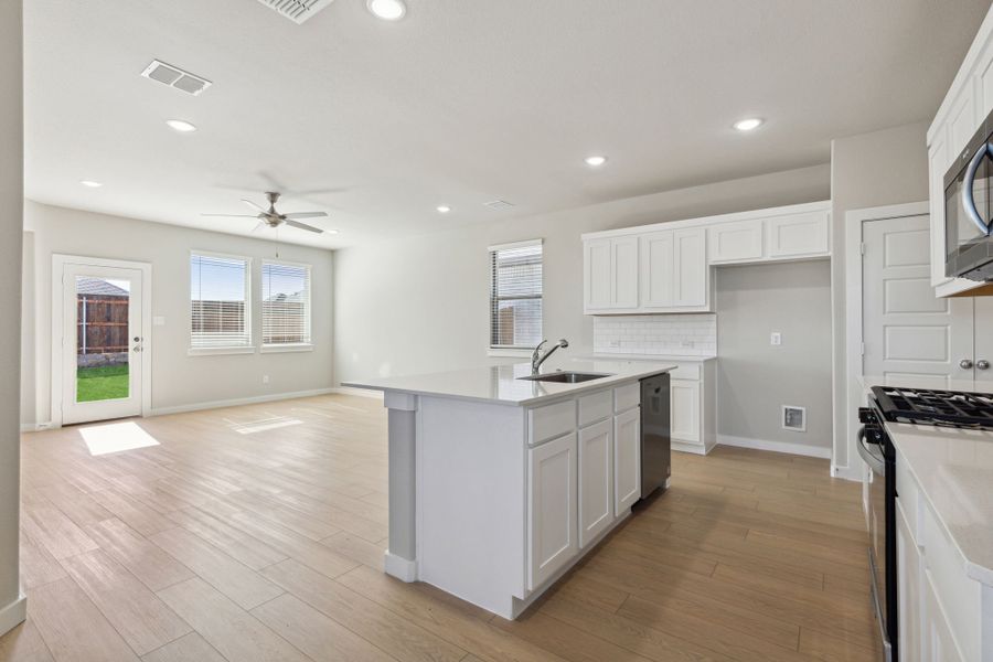 Kitchen in the Oak home plan by Trophy Signature Homes – REPRESENTATIVE PHOTO