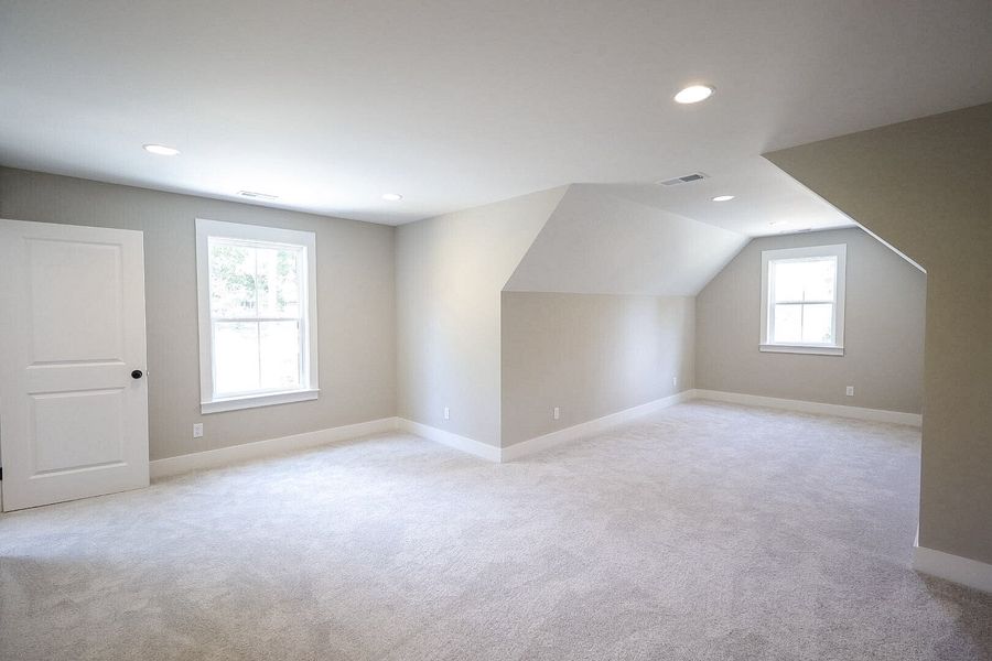 Spacious, unfurnished interior of a new home in Baker Road, Birchwood (Image 51).