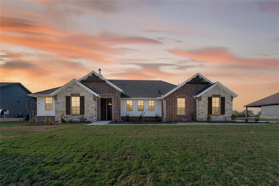 Front exterior of a new home in Fairview Meadows, New Fairview, TX, highlighting curb appeal (Image 20). Front exterior of a new home in Fairview Meadows, New Fairview, TX, highlighting curb appeal (Image 20).
