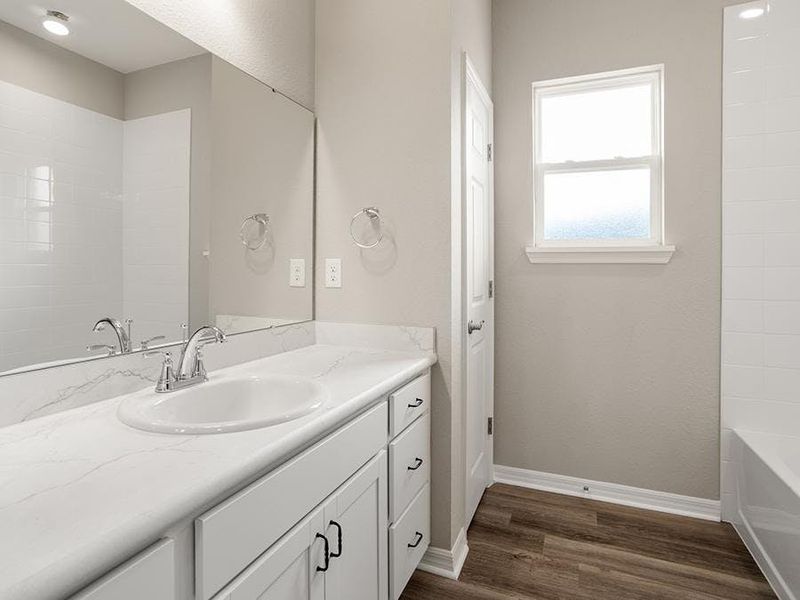 Bath 2 is conveniently adjacent to bedroom 2, and a separate powder room serves your guests.