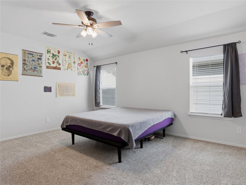 Soft carpeting pairs with multiple windows in this comfortable secondary bedroom. Soft carpeting pairs with multiple windows in this comfortable secondary bedroom.