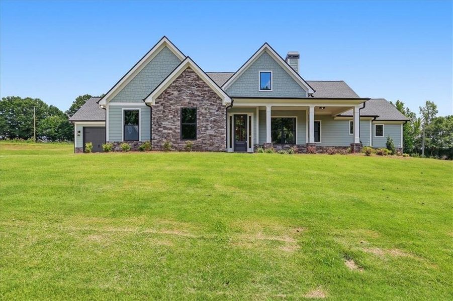 Front exterior of a new home in , Statham, GA, highlighting curb appeal (Image 30). Front exterior of a new home in , Statham, GA, highlighting curb appeal (Image 30).
